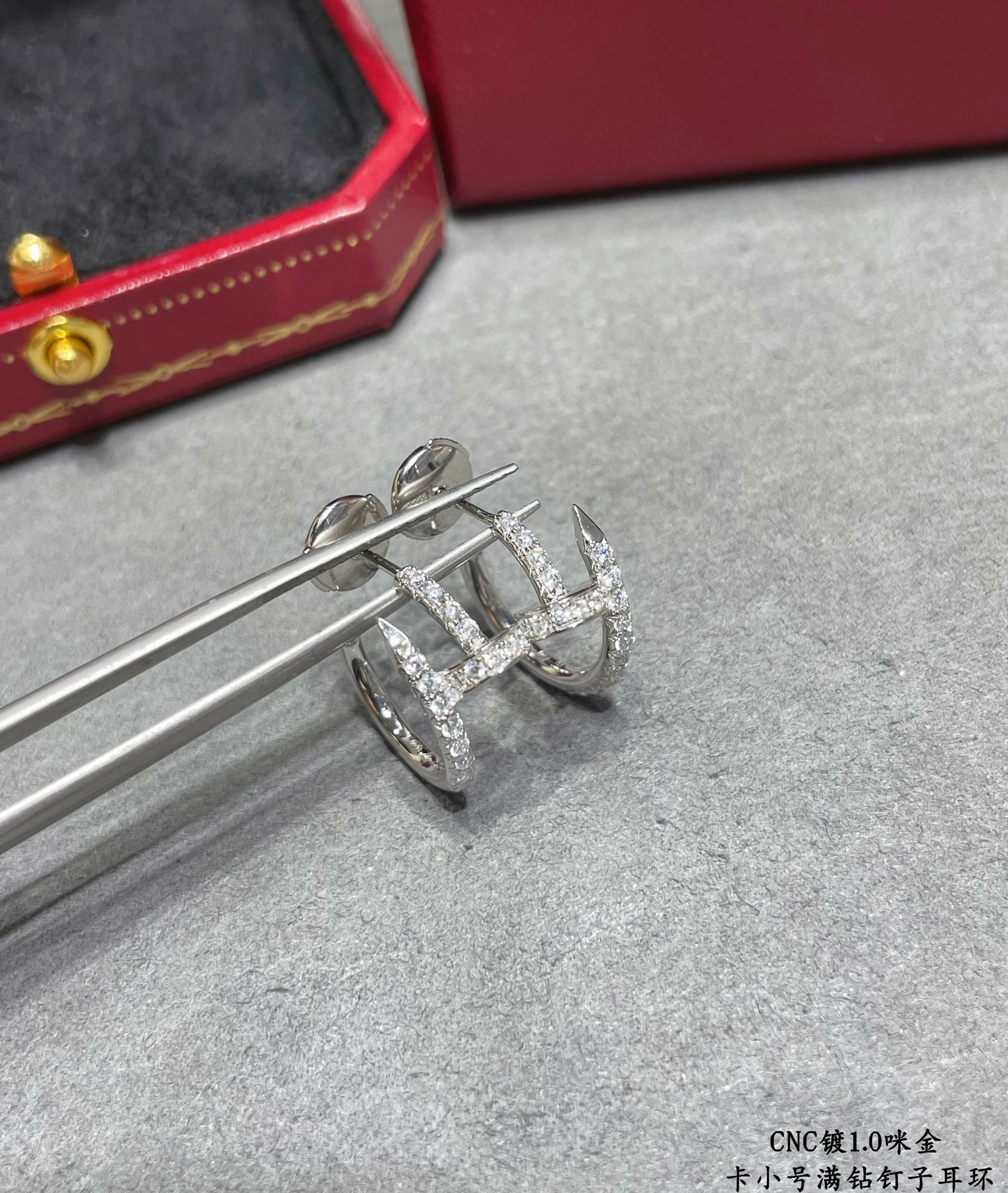 ca*t*er fully Di*m*nd-encrusted small nail earrings