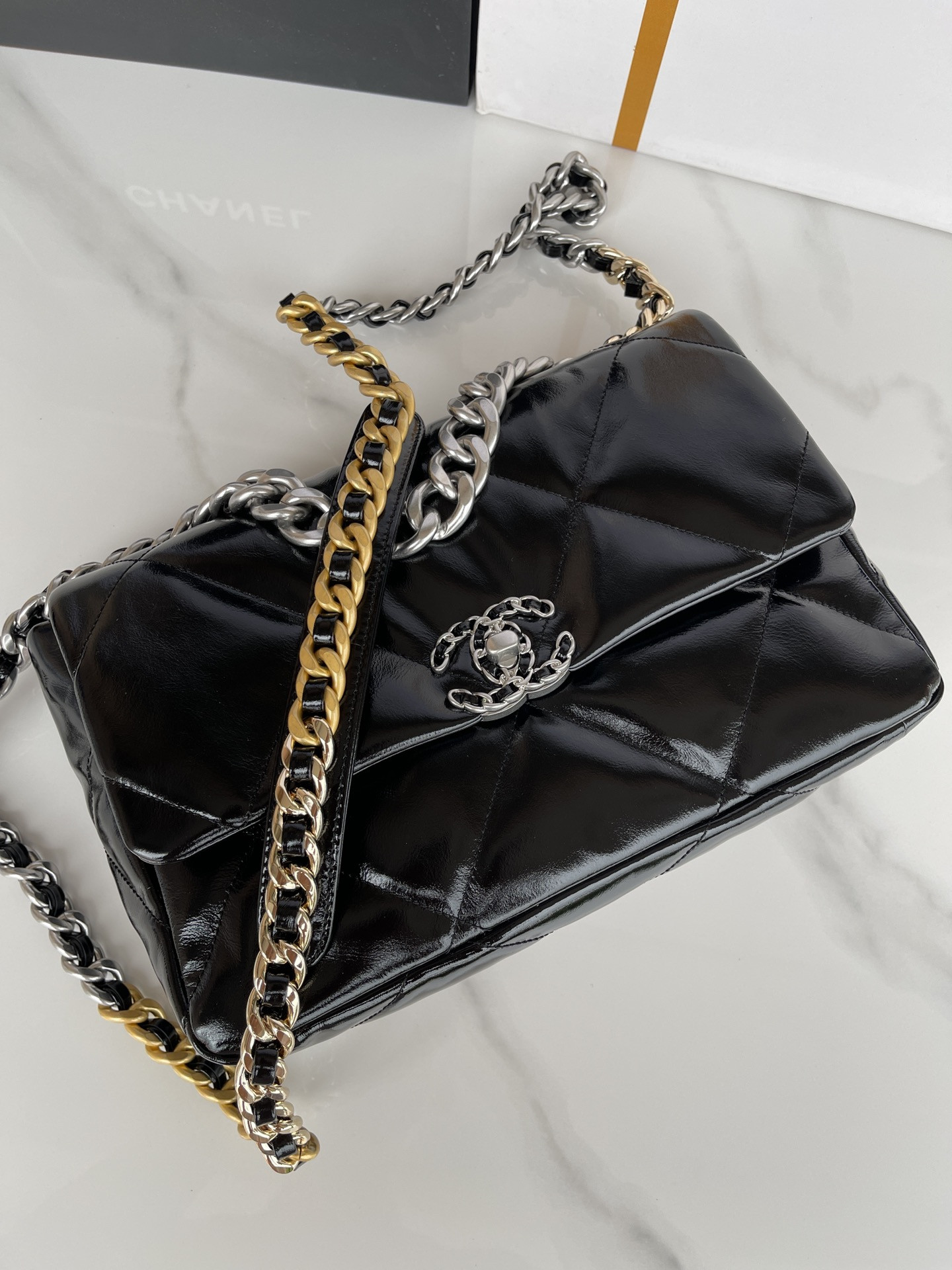 Ch*el 19 large handbag shiny leather, gold-tone, silver-tone & ruthenium-finish metal black 7.8 × 11.7 × 3.9 in